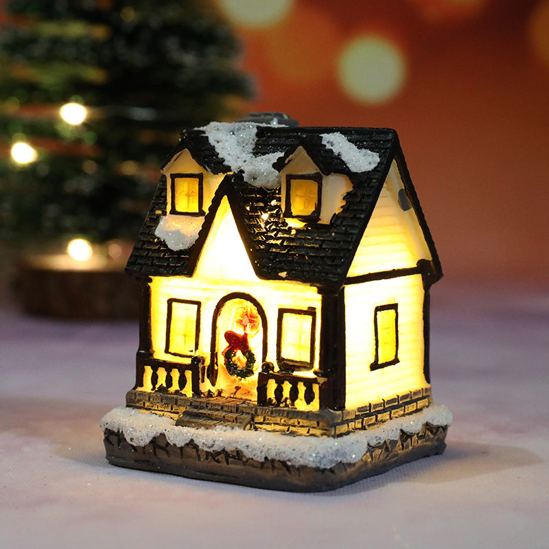 Miniatúrny LED osvetlený vianočný domček
