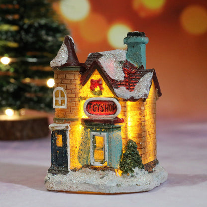 Miniatúrny LED osvetlený vianočný domček